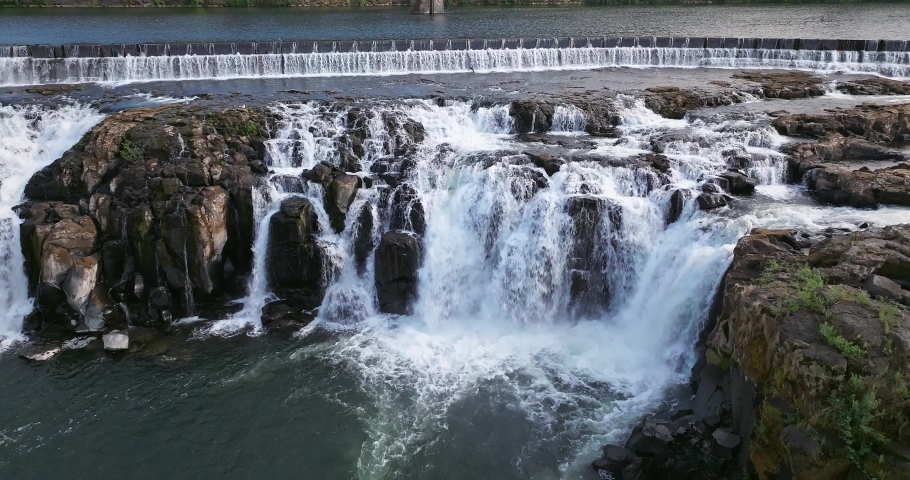 Willamette Falls Oregon City Oregon.   It is the largest waterfall in the Northwestern United States by volume, and the seventeenth widest in the world.  Horseshoe in shape, it is 1,500 feet wide.