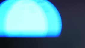 Intermittent Police Blue Light Flashing Blurred on Black or Dark Background 