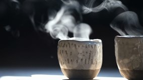 Scented Coffee Cup Steaming in Morning Light on Dark Background