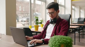 Camera flies around developer writing program code on computer display alone in office. Freelancer typing code on laptop keyboard sitting at desk in coworking. Programmer working on online application - Powered by Shutterstock - Get 15% off with code: PIKWIZARD15