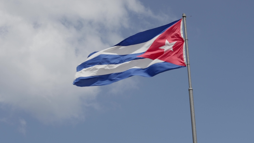 Cuban National Flag waving in a sunny day - Slow Motion  Royalty-Free Stock Footage #1095161923