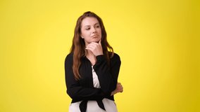 4k video of shocked woman with open mouth on yellow background. Concept of shocked woman.