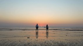 beach couple relax silhouette Drone Video Red and Blue Sky Best Couple Drone Shoot  Couple Filings 