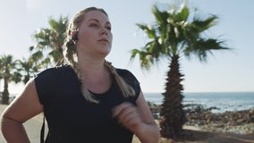 Plus size woman running on beach, fitness workout Australia and active lifestyle listening to music. Healthy outdoor training motivation, strong cardio female runner and streaming exercise podcast - Powered by Shutterstock - Get 15% off with code: PIKWIZARD15