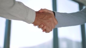 Handshake, partnership and trust in support, teamwork or deal together against a blurred background. Business people shaking hands in agreement, success and help in company b2b or meeting welcome - Powered by Shutterstock - Get 15% off with code: PIKWIZARD15