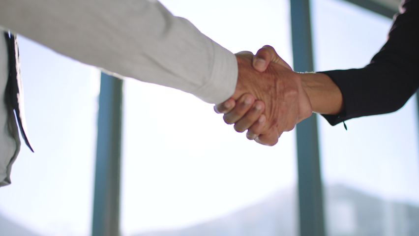 Handshake, meeting and b2b with a business man and woman shaking hands in an office boardroom. Team, crm and thank you with a male and female employee working in collaboration or partnership Royalty-Free Stock Footage #1095167259