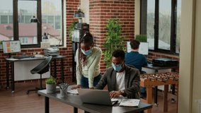 African american people working on business project with charts, analyzing paperwork and research information on laptop. Man and woman brainstorming ideas during covid 19 epidemic. - Powered by Shutterstock - Get 15% off with code: PIKWIZARD15
