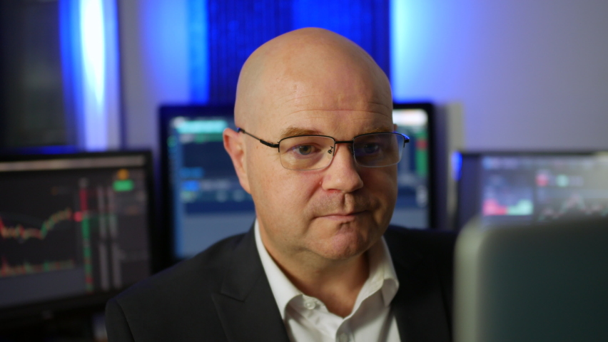 A depressed stock trader shaking his head after losing money on the forex crypto exchange after a market crash  Royalty-Free Stock Footage #1095174793