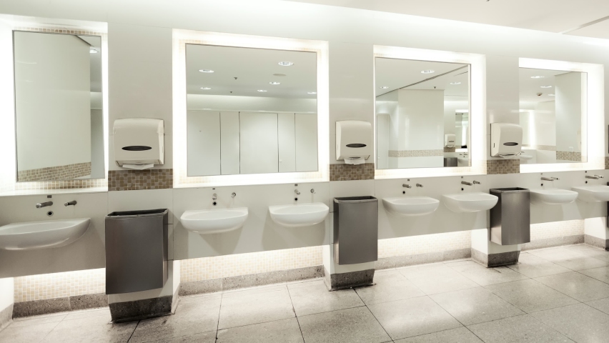 Restroom interior with big mirrors and white sinks, Nobody Royalty-Free Stock Footage #1095175505