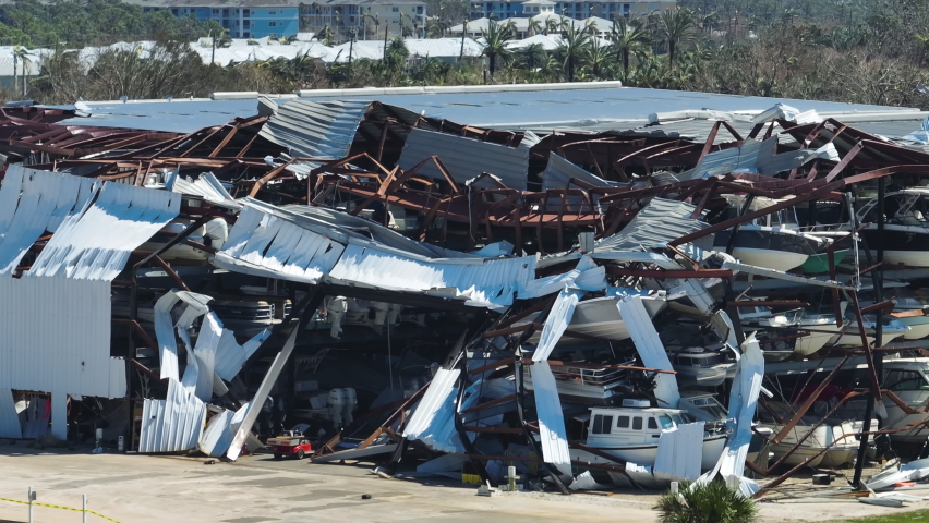 Hurricane Ian destroyed boat station in Florida coastal area. Natural disaster and its consequences