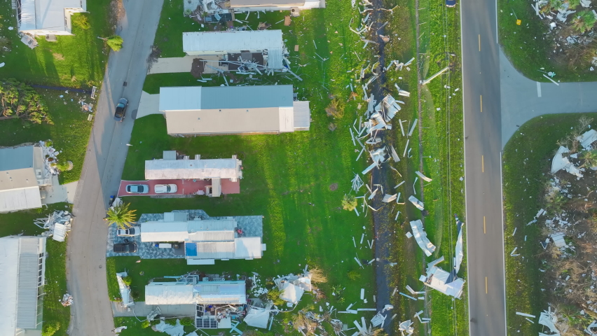 Hurricane Ian destroyed homes in Florida residential area. Natural disaster and its consequences