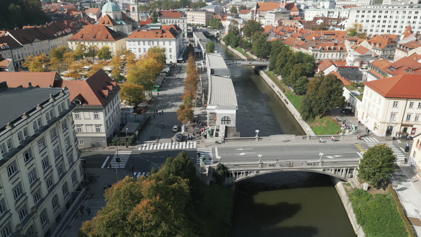 Aerial shot of Dragon bridge and Ljubljanica river in Ljubljana, Slovenia Royalty-Free Stock Footage #1095182731