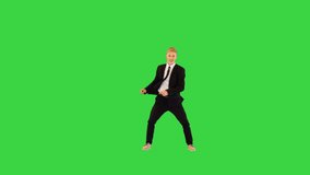 Smart guy in black office suit dances performing different elements on a Green Screen, Chroma Key. - Powered by Shutterstock - Get 15% off with code: PIKWIZARD15