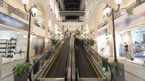 Motion escalators at the modern shopping mall timelapse hyperlapse. a multi-storey shopping center