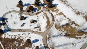 Playground Park After Snowfall • Aerial Drone Video Rotation • HD Horizontal B Roll