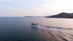 Aerial Panning Shot of Wooden Fishing Boat Cruising in Aegean Sea, Natural Morning light, Cinematic 4K Footage