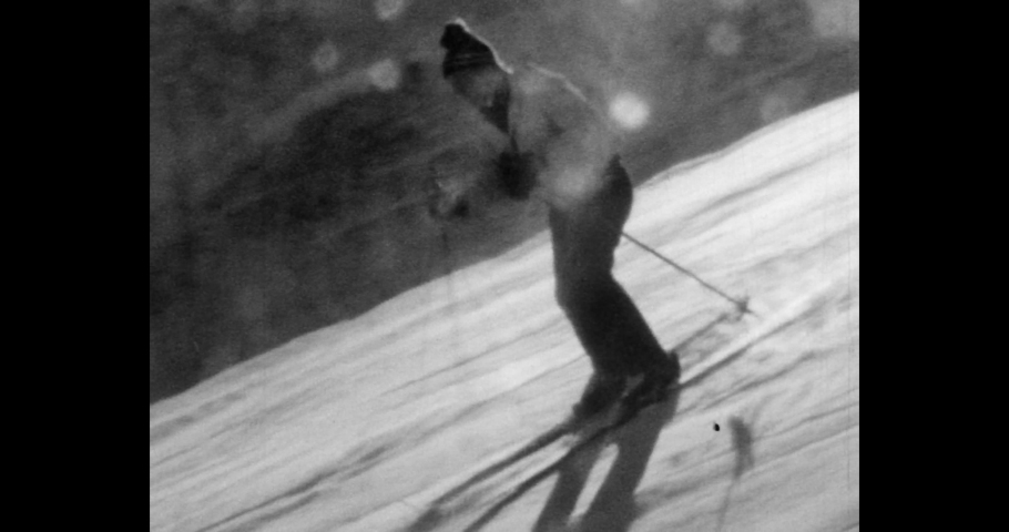 Cheget, Russia, february 11 1980s: Man skiing down a snowy slope. The sportsman makes sharp turns.