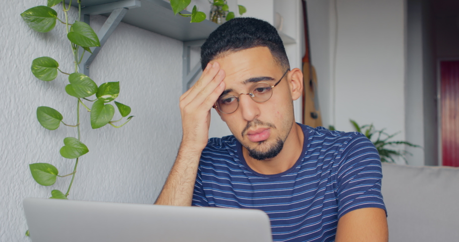 footage of a young man using a laptop and looking stressed Royalty-Free Stock Footage #1095211771