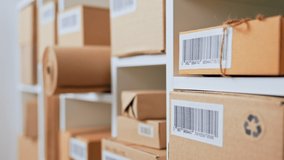 An employee of a postal company scans a barcode on a cardboard box, entering data on sending a parcel to the database of sending parcels to customers, accounting for parcel boxes in a warehouse - Powered by Shutterstock - Get 15% off with code: PIKWIZARD15