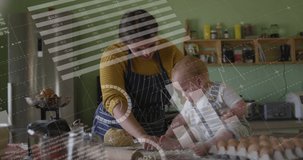 Animation of data processing over caucasian mother cooking with baby. Global business and digital interface concept digitally generated video.