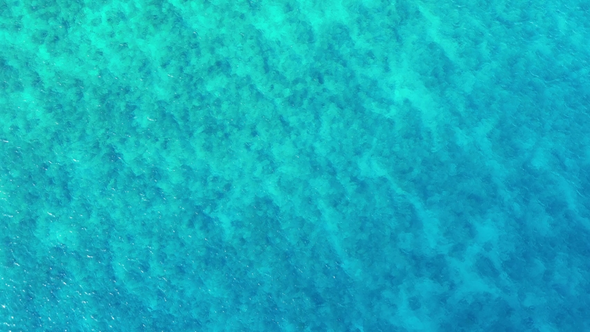Green blue water ocean sea Caribbean aerial view from the Cayman Islands shore beach on the island of Grand Cayman in the Eastern District East End and North Side Royalty-Free Stock Footage #1095215775