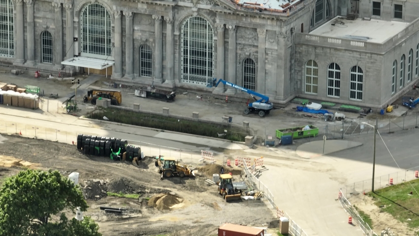 Detroit , Michigan , United States - 10 01 2022: Michigan Central Station in Detroit Aerial 4K Move up reveal Ambassador Bridge