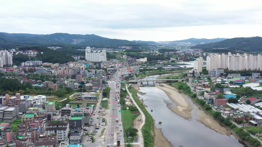 Yongin, South Korea 24 August 2022. Aerial drone view of the constructions development site. Flight over new multi storey apartment constructions development site with high tower cranes. 
