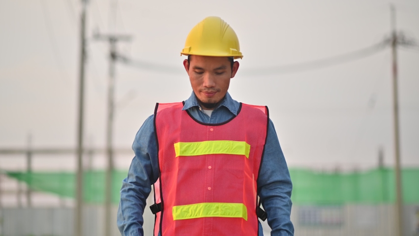 Asian Engineer survey on site construction engineering, Asia Worker smile on civil site building and safety suit helmet hard hat Royalty-Free Stock Footage #1095233387