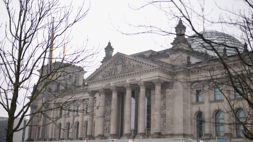 Reichstag building. German government. Glass dome. Reichstag building, home of the German Parliament Deutscher Bundestag, inscription over columns reads The German People