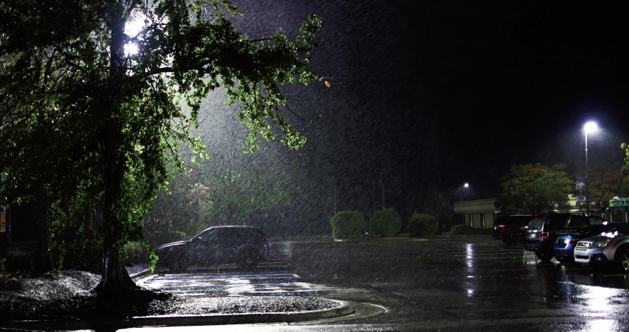 Parking zone, night street under the heavy rain caused by tropical storm Ian on 09.30.2022 in Raleigh, NC, USA