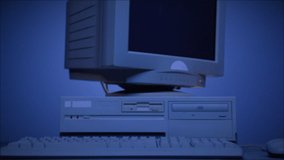 Retro pc with loading code console, programmer making scripts, green basic screen, Old computer studio blue night background close-up, Desktop vintage retro wave display, late 90s PC.