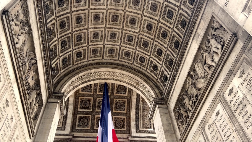 French Flag Under The Arc de Triomphe In Paris, France. - tilt down