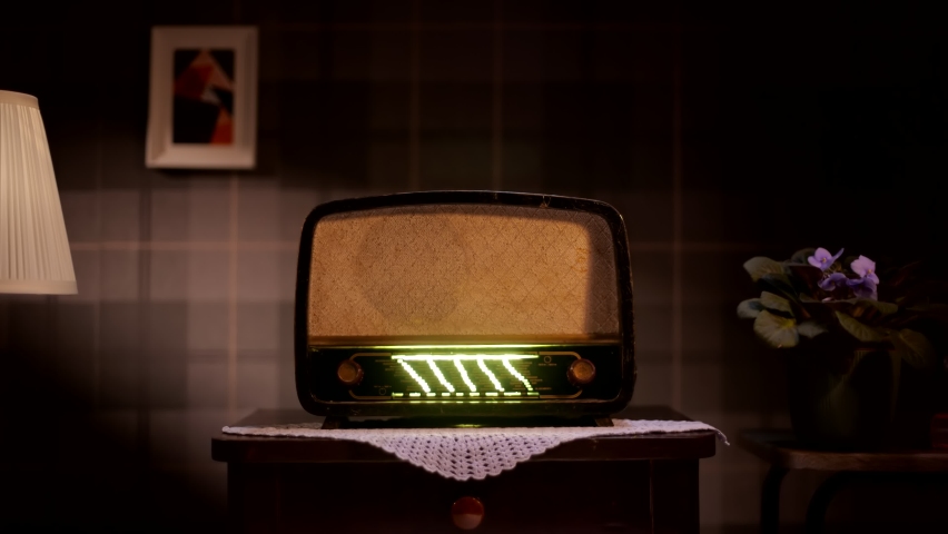 Old retro radio on table against vintage wall background | Shutterstock HD Video #1095266771
