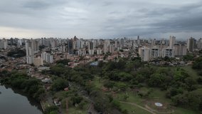 Aerial image of the city of Piracicaba, buildings, houses, vegetation and the Piracicaba River that runs through the city.