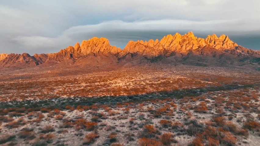 Afternoon Sunlight On Beautiful Organ Mountains Near Las Cruces In New Mexico. wide drone shot