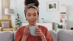 Woman, drinking coffee or relax on living room sofa in new house or home as real estate homeowner. Smile, happy or laughing person with tea after mortgage loan approval or property investment success - Powered by Shutterstock - Get 15% off with code: PIKWIZARD15