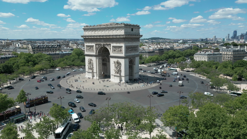 Triumphal arch and car traffic on roundabout, Paris in France. Aerial drone view Royalty-Free Stock Footage #1095279337