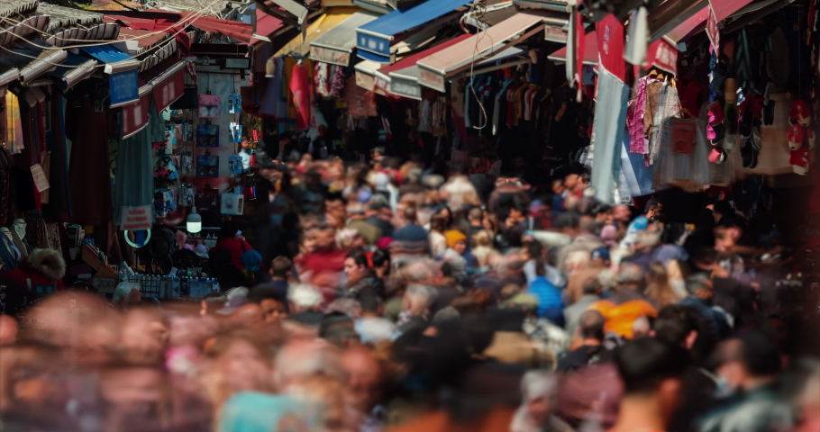 Timelapse motion: the movement crowd of people in Grand Bazaar, Istanbul, Turkey. Tourists walking and shopping in historical market. Royalty-Free Stock Footage #1095291375
