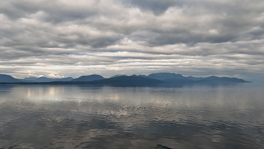 Inside Passage Alaska glass smooth ocean. The Inside Passage a coastal route for ships and boats. Network of natural island channels weave through the Pacific Northwest coast of the North American.
