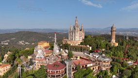 Fantastic overview aerial footage around the Expiatory Church of the Sacred Heart of Jesus (Temple Expiatori del Sagrat Cor) in Tibidabo mountain in Barcelona, Catalonia, Spain
