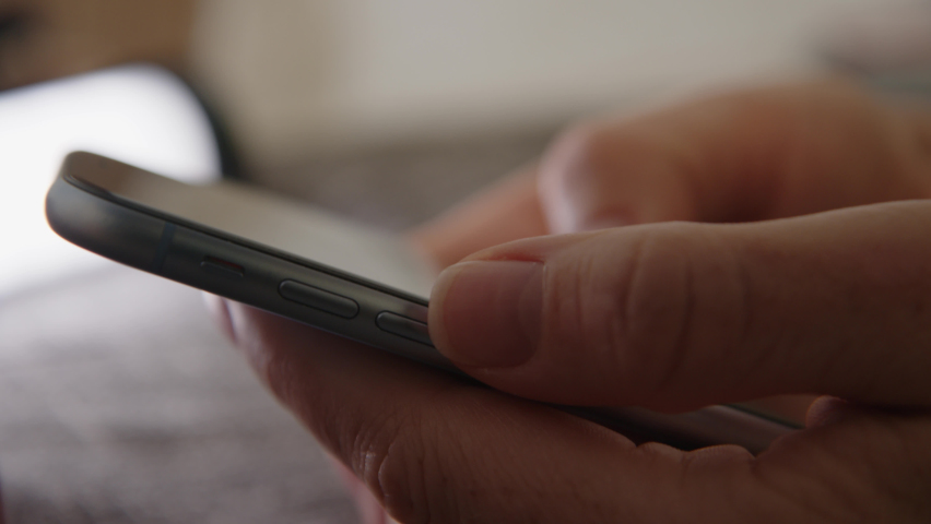 Close up view of female hands using phone. girl