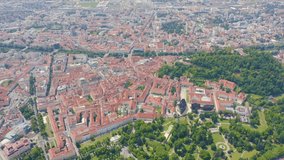 Inscription on video. Graz, Austria. The historic city center aerial view. Mount Schlossberg (Castle Hill). Arises from blue water, Aerial View, Point of interest