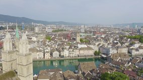 Inscription on video. Zurich, Switzerland. Panorama of the city from the air. St. Peter Church. Shimmers in colors purple, Aerial View, Point of interest