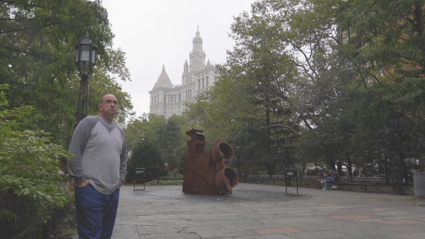 Man Standing in New York City with Federal Courthouse Behind Him 4K