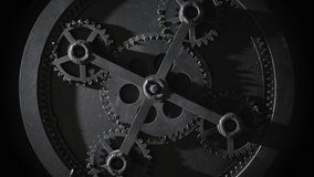 Mechanism with five rotating gears. Retro vintage cogwheels of machine in ancient old factory. Moving engine parts and internal details, steampunk concept. Isolated on black, zoom in - Powered by Shutterstock - Get 15% off with code: PIKWIZARD15