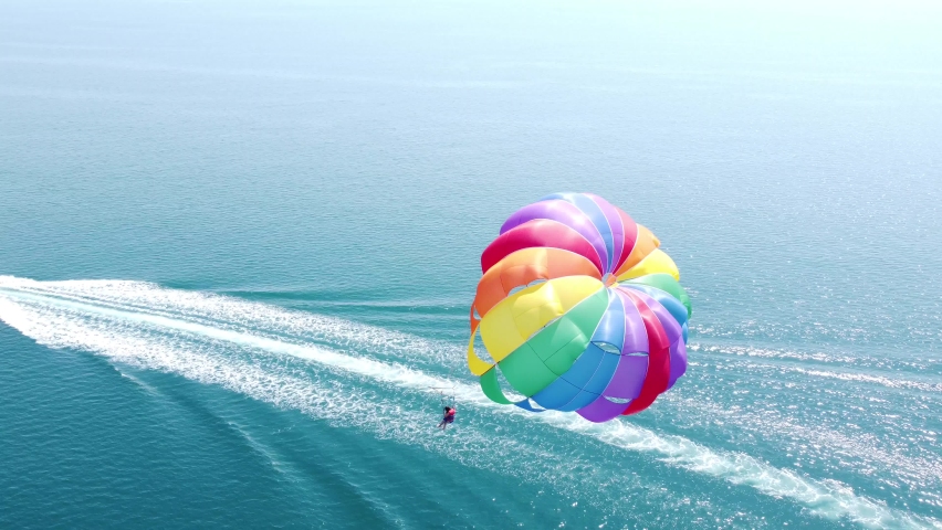 Parasailing. Fun water sports. Adrenaline. Parachute high in the sky. Royalty-Free Stock Footage #1095331577