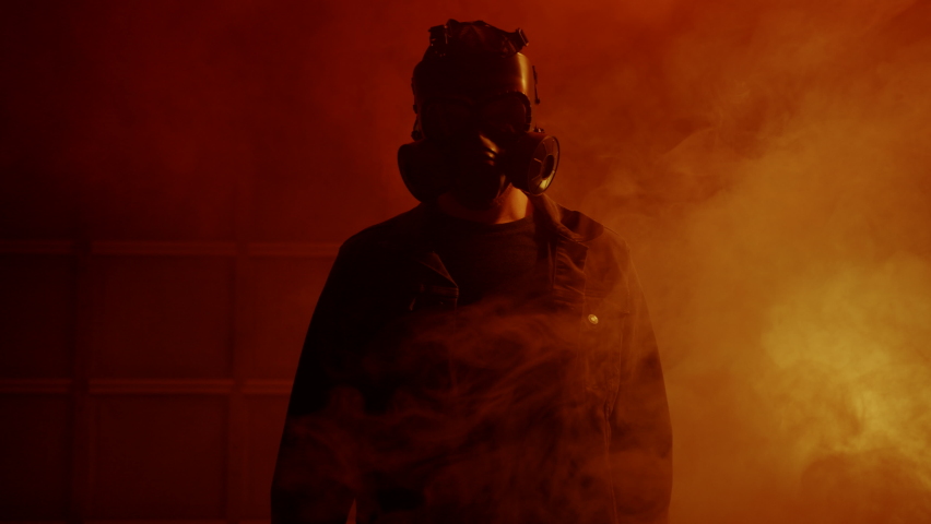 Creepy Man in Scary Gas Mask Surrounded by Smoke and Chemicals Royalty-Free Stock Footage #1095337463