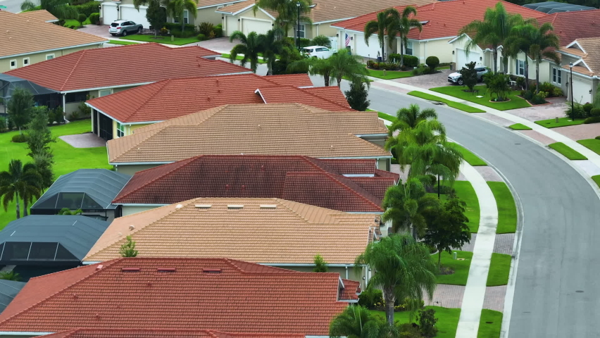 Aerial view of tightly packed homes in Florida closed living clubs. Family houses as example of real estate development in american suburbs