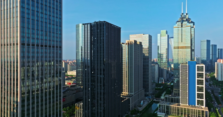 Aerial footage of city skyline and modern commercial buildings scenery in Suzhou, China. Famous CBD building complex in Suzhou.