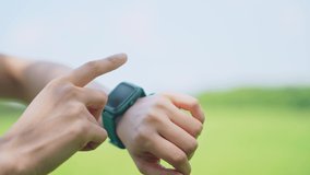Woman using a smart watch outdoors. - Powered by Shutterstock - Get 15% off with code: PIKWIZARD15